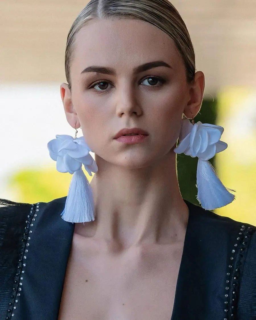 Polished, long-wear makeup with a sleek bun