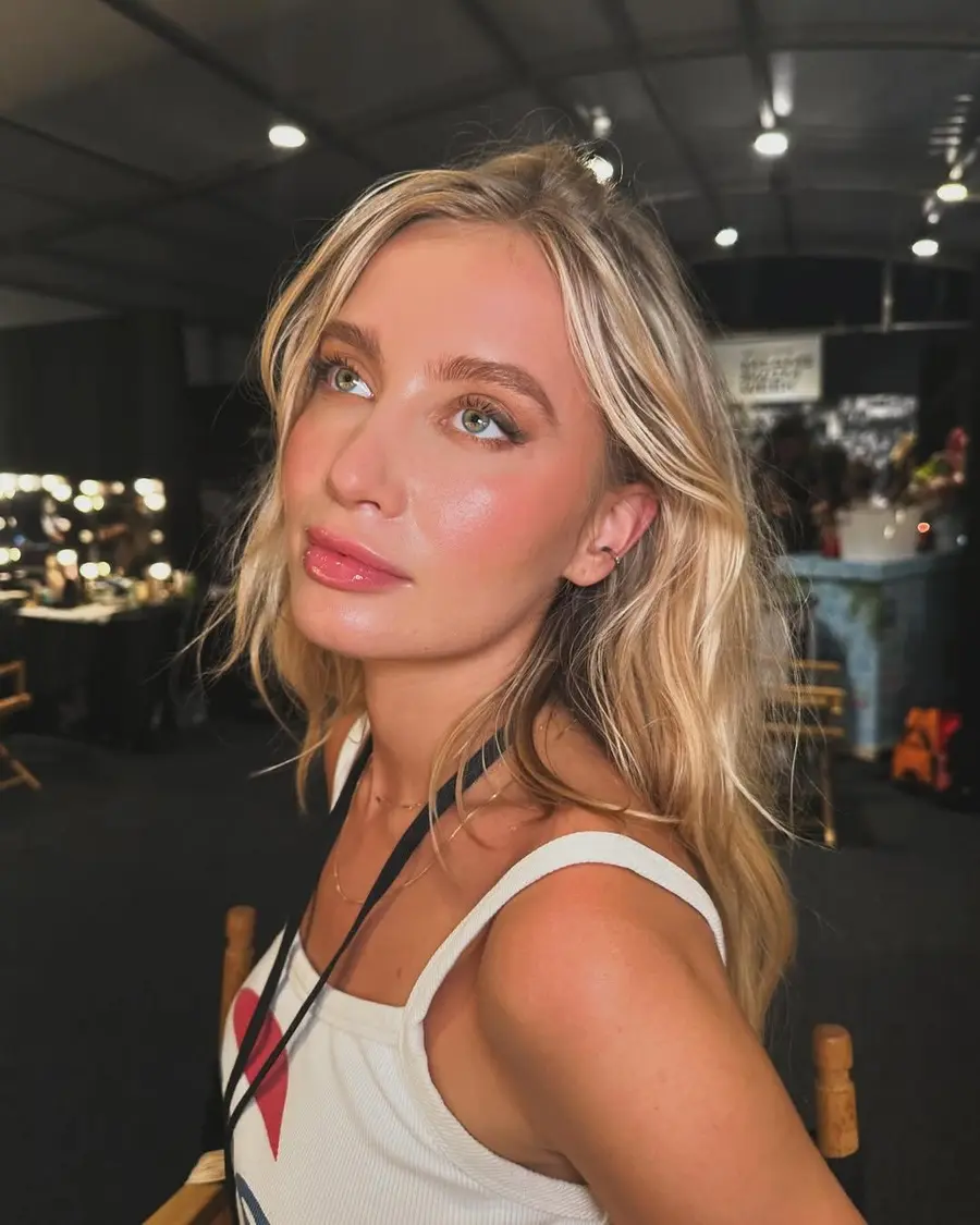 Glowing backstage makeup at a fashion event